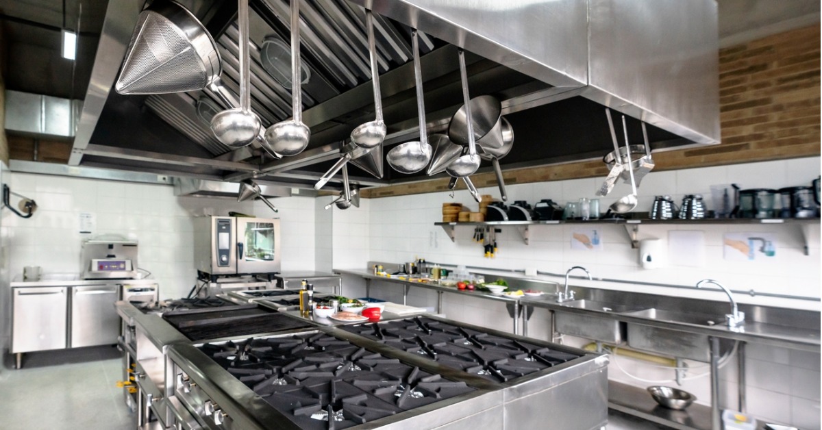 A commercial kitchen that has been cleaned and organised at the end of a shift in order to help prevent cross contamination.